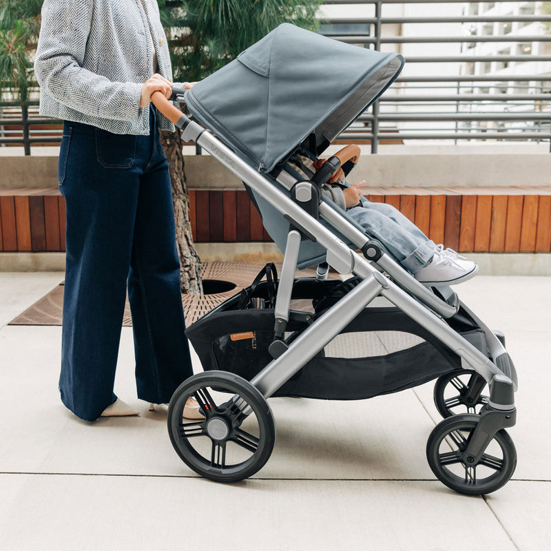 Woman pushes toddler in UPPAbaby VISTA V3 Stroller - CALLUM (Stone Blue)