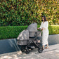 Mom pushes two babies in UPPAbaby Bassinet V3 - GREYSON (Charcoal Melange) on Vista V3 stroller frame