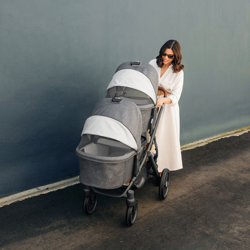 Mom pushes two babies in UPPAbaby Bassinet V3 - GREYSON (Charcoal Melange) on Vista V3 stroller frame