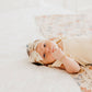 Baby girl wearing Copper Pearl Classic Nylon Bow Headband - Eden