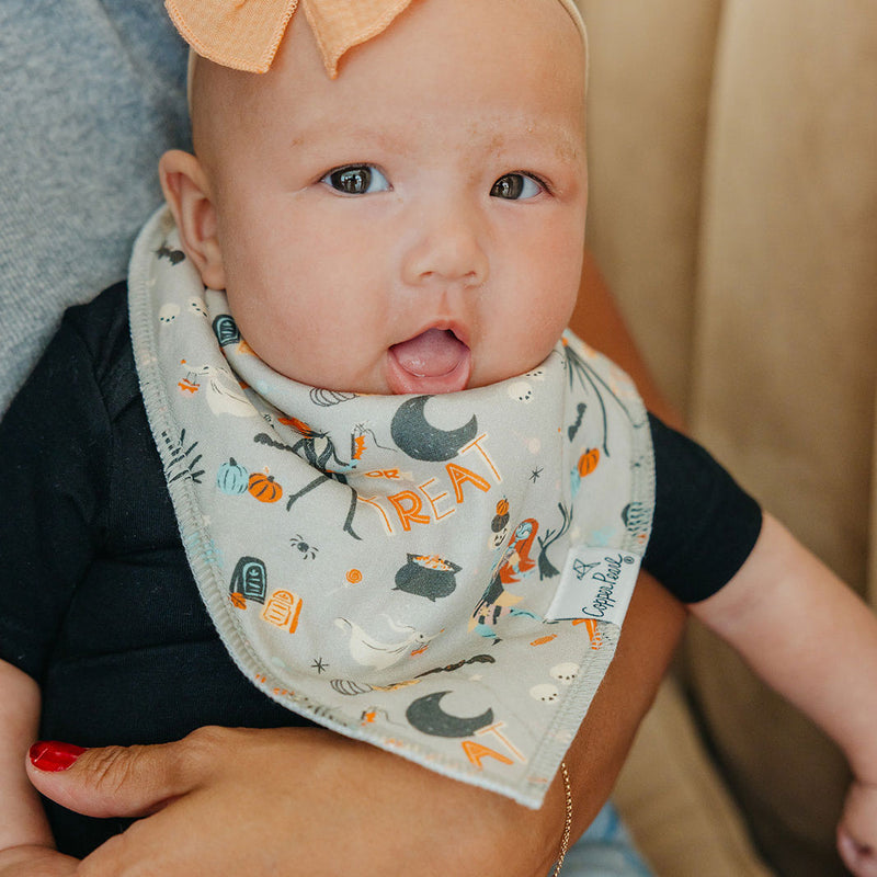 Baby girl wearing Copper Pearl Single Holiday Bandana Bib - Nightmare Before Christmas - Grey