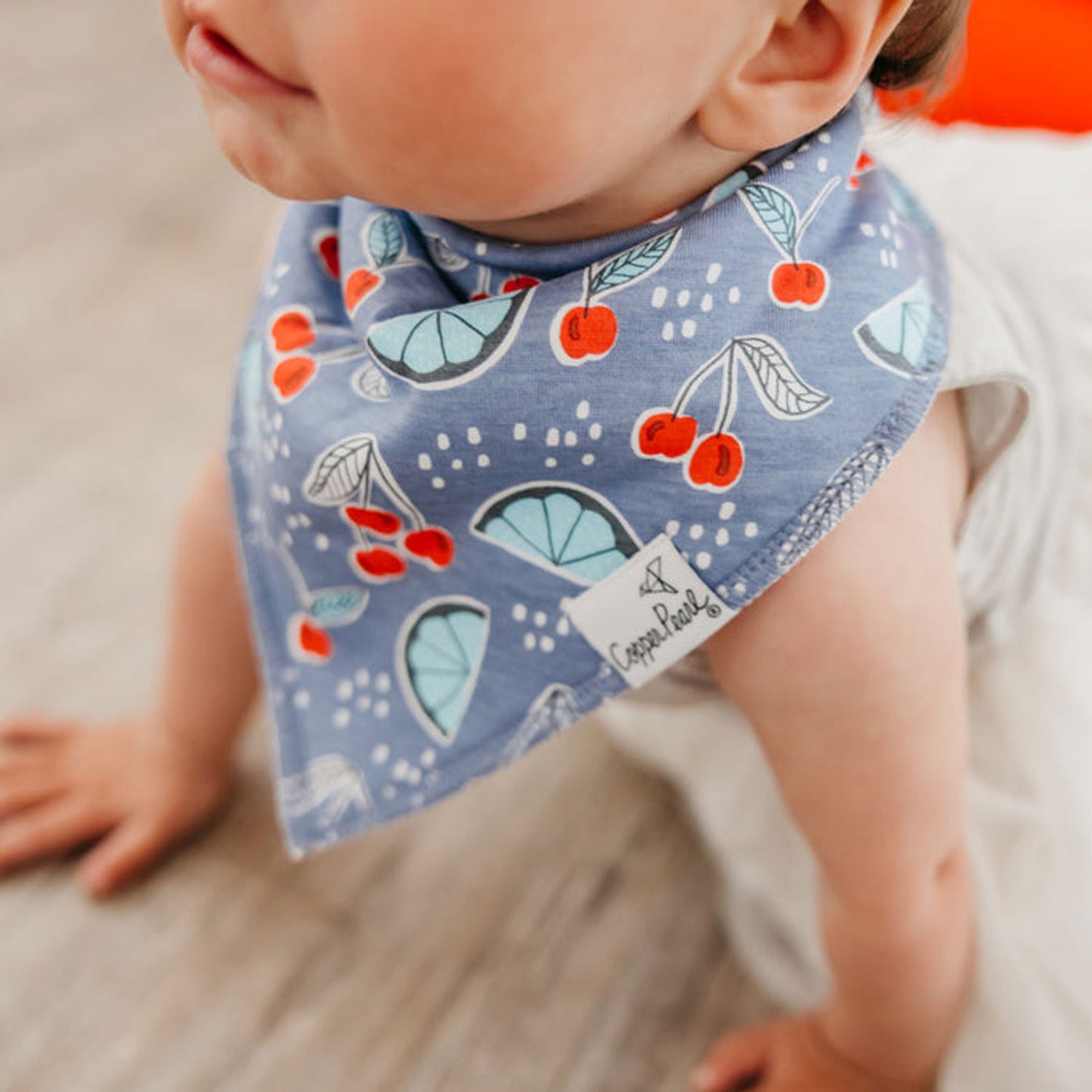 Baby wearing Copper Pearl Single Holiday Bandana Bib - Liberty Fruit