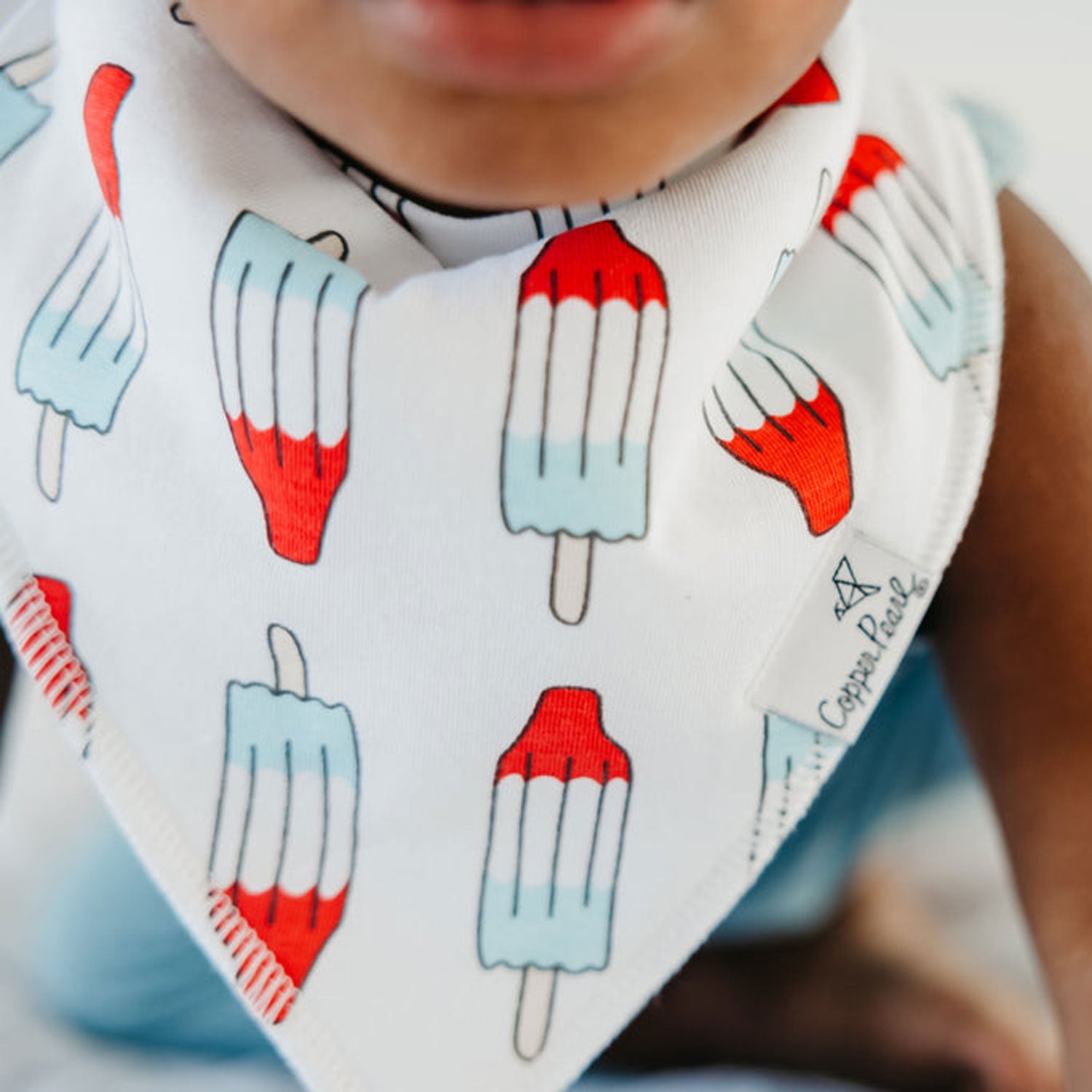 Baby wearing Copper Pearl Single Holiday Bandana Bib - Spangled Popsicles