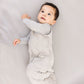 Baby wearing Dreamland Baby Dream Weighted Sleep Sack - Moon Grey