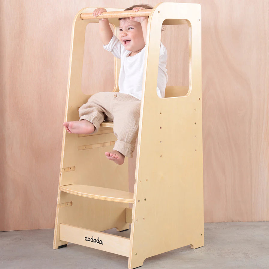 Boy sitting on Dadada Toddler Tower - Natural