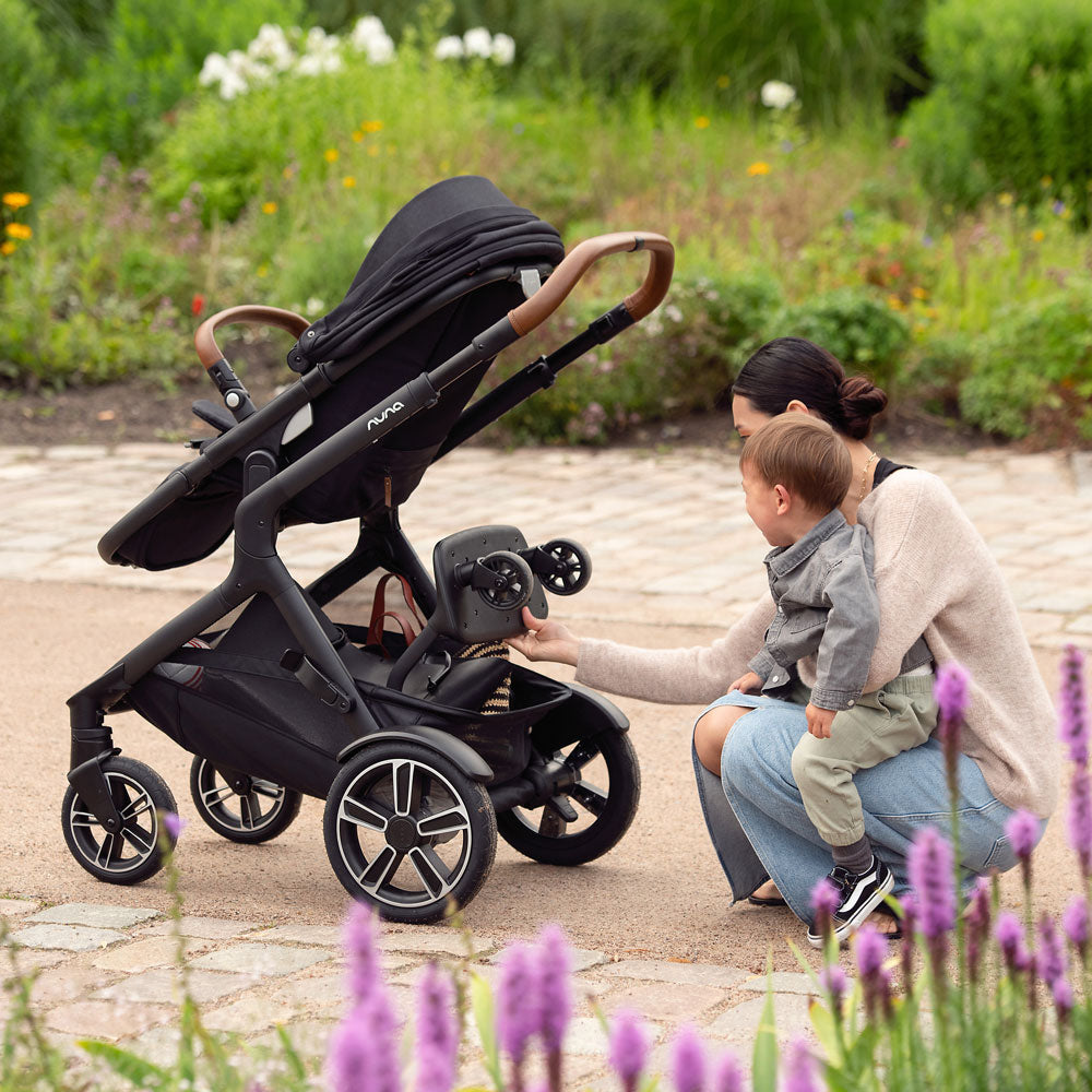 Mom using Nuna DEMI Next Stroller and PIPA Urbn Car Seat Travel System - Caviar