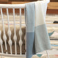 UPPAbaby Knit Blanket - Blue over chair