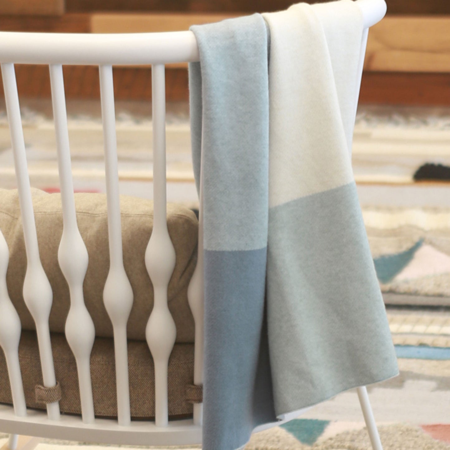 UPPAbaby Knit Blanket - Blue over chair