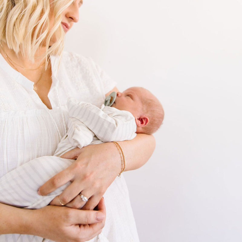 Mom holding baby wearing Lou Lou and Company Knotted Gown - Gus