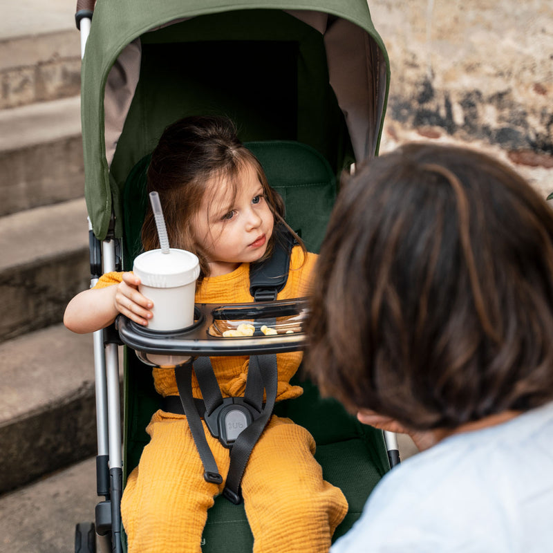 child in stroller with UPPAbaby Snack Tray - MINU