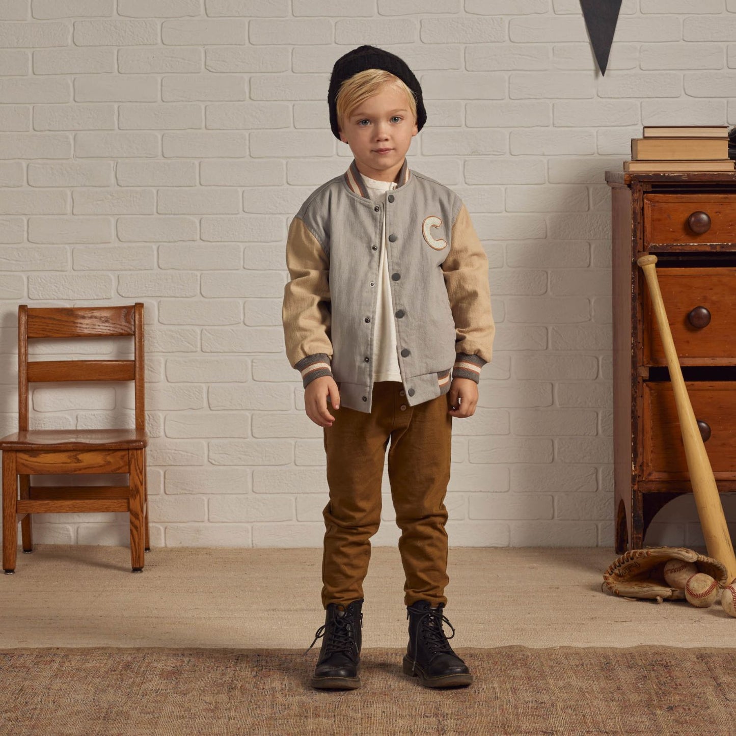 Boy wearing Rylee and Cru Varsity Jacket - Ivory / Slate