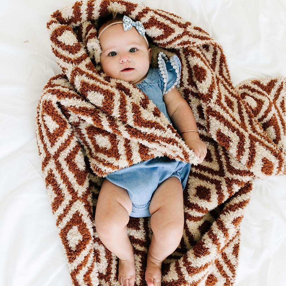 Baby girl using Saranoni Receiving Double-Layer Bamboni Blanket - Khmer