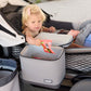 Little girl sitting in Veer Cruiser pulls snack out of Veer Lunch Cooler - Gray Granite