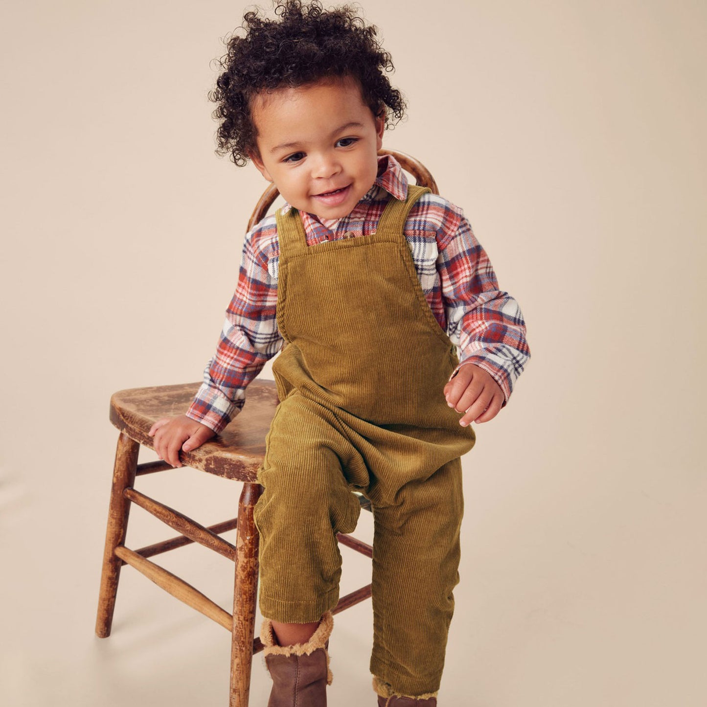 Little boy wearing Tea Collection Corduroy Baby Overalls - Raw Umber