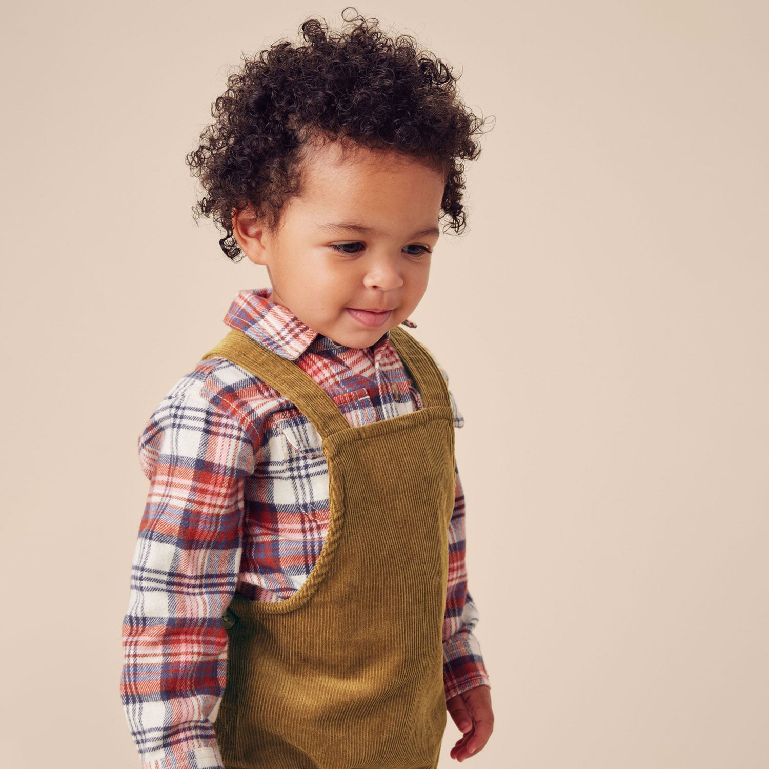 Little boy wearing Tea Collection Corduroy Baby Overalls - Raw Umber