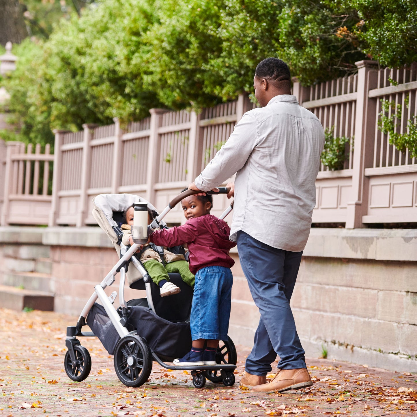 child rides on UPPAbaby PiggyBack - VISTA