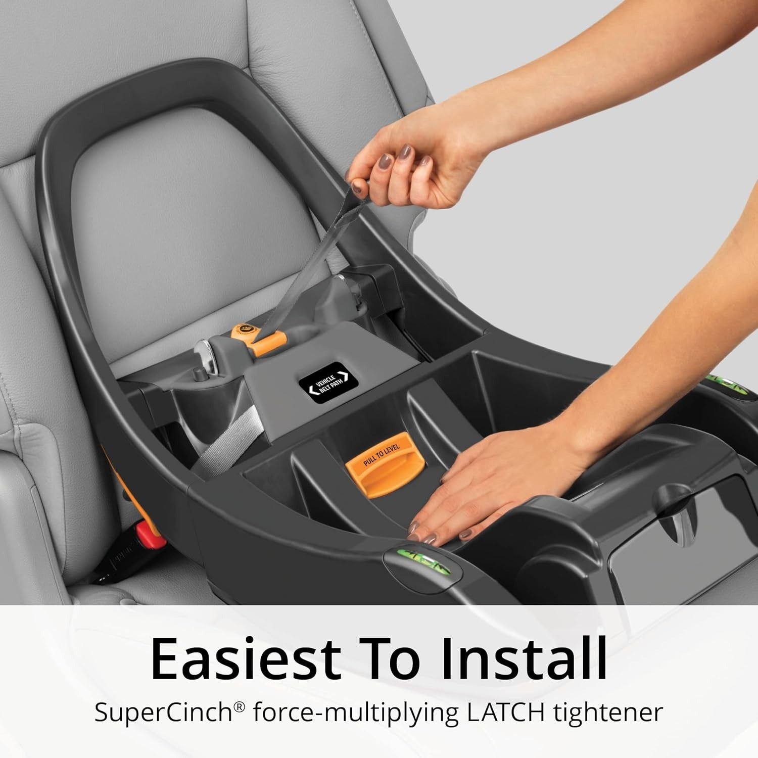 Mom installs base of Chicco KeyFit 35 ClearTex Infant Car Seat - Cove