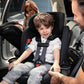 Dad puts toddler boy in Nuna REVV Rotating Convertible Car Seat - Caviar