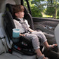 Little boy sits forward facing in Nuna REVV Rotating Convertible Car Seat - Caviar