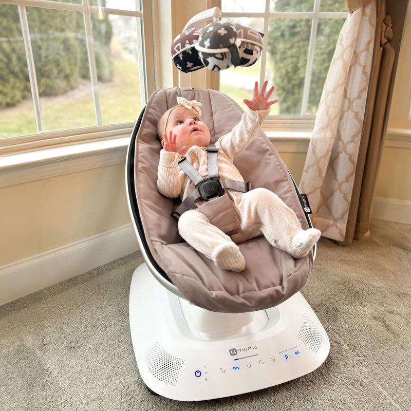 Baby in 4moms mamaRoo 5 - Multi-Motion Baby Swing 