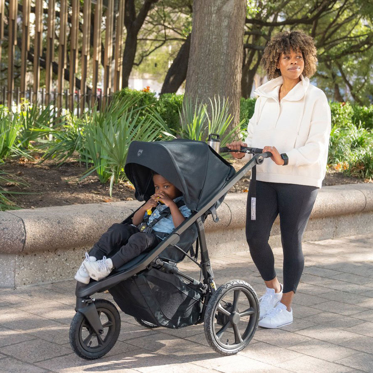 Mom walks with BOB Wayfinder Jogging Stroller - Nightfall