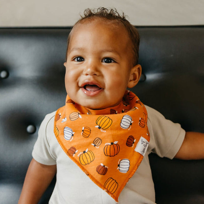 Baby wearing Copper Pearl Single Holiday Bandana Bib - Bones Pumpkins