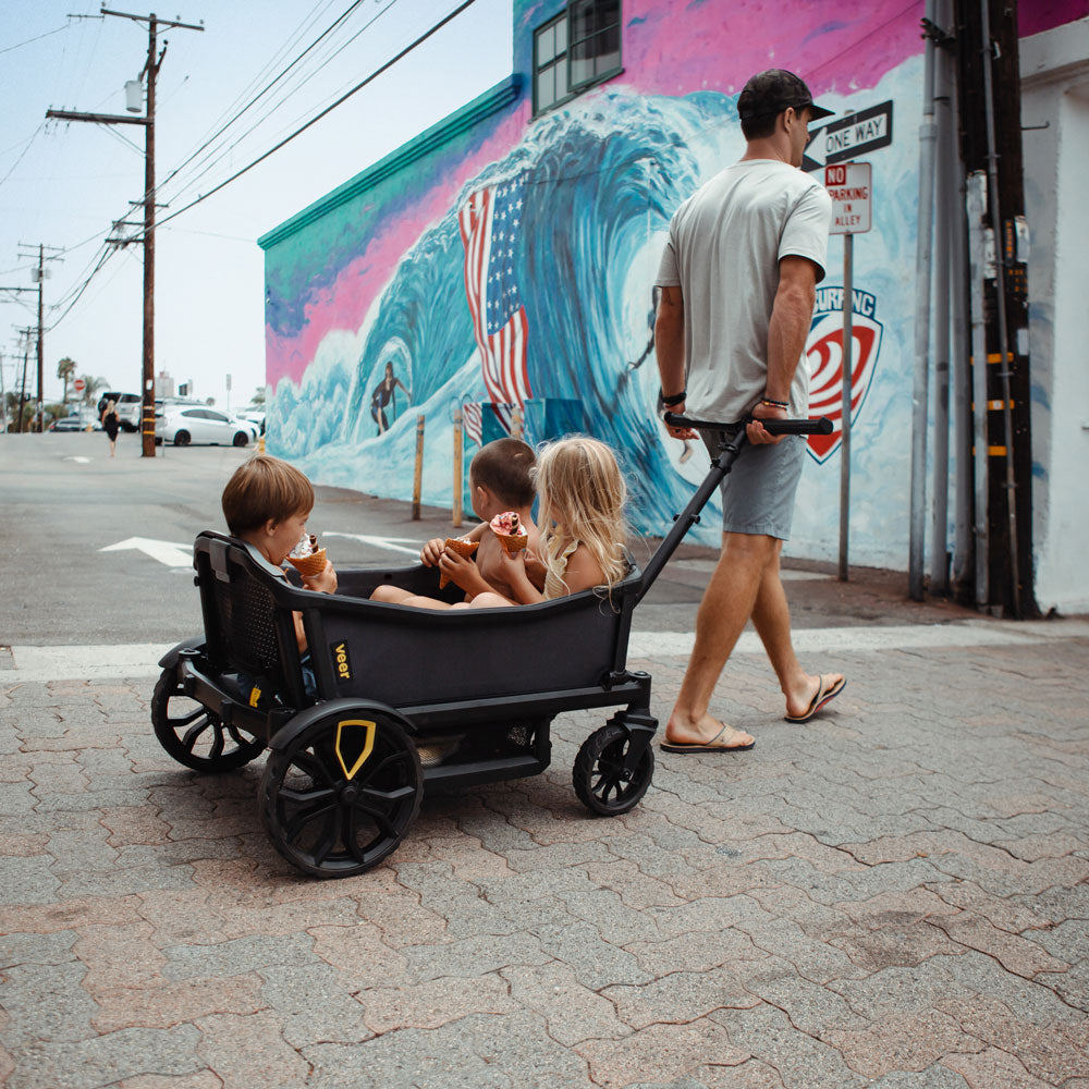 Man pulling Children in Veer Cruiser XL