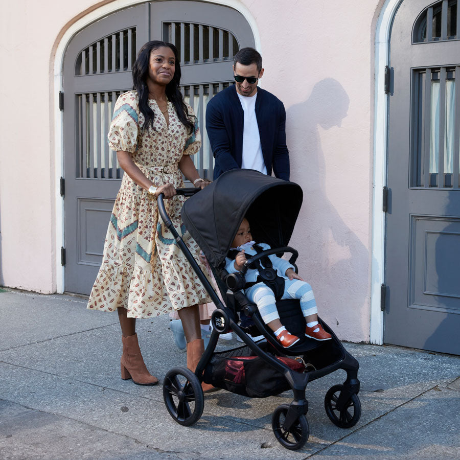 Parents push Baby Jogger City Sights Stroller