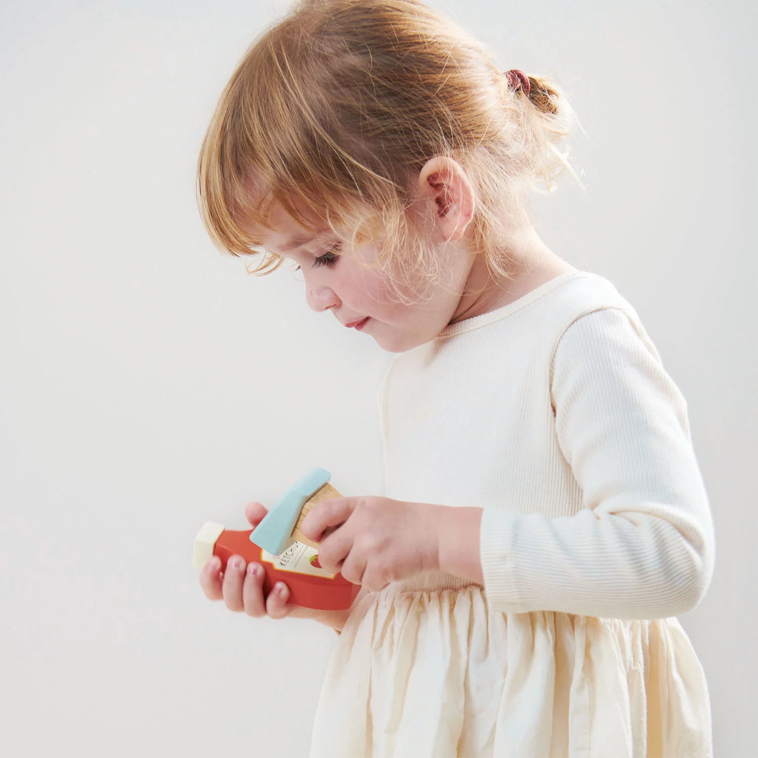 Little girl scans item with scanner from Tender Leaf Toys General Stores Till