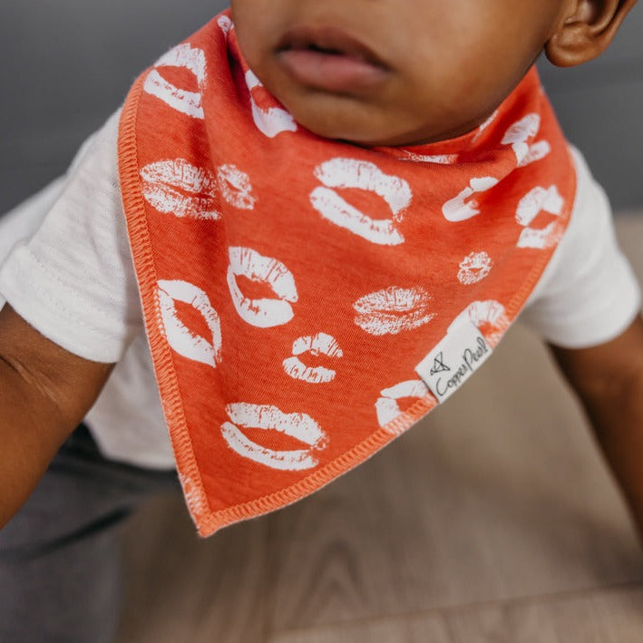 Baby wearing Copper Pearl Single Holiday Bandana Bib - Crush