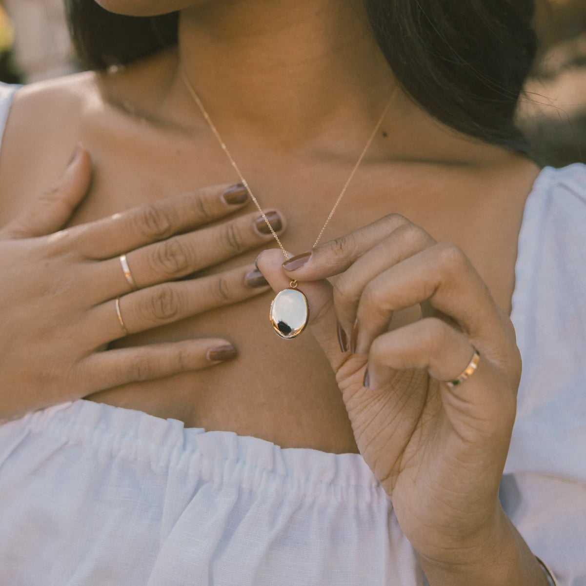 Woman Wearing Made by Mary Gold Filled Oval Locket Necklace 